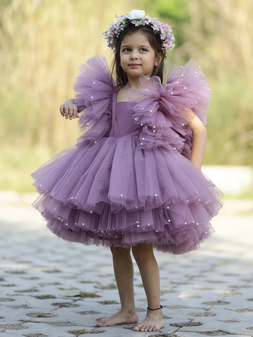 side view of elegant lavender tulle gown with pearl details for special occasions.