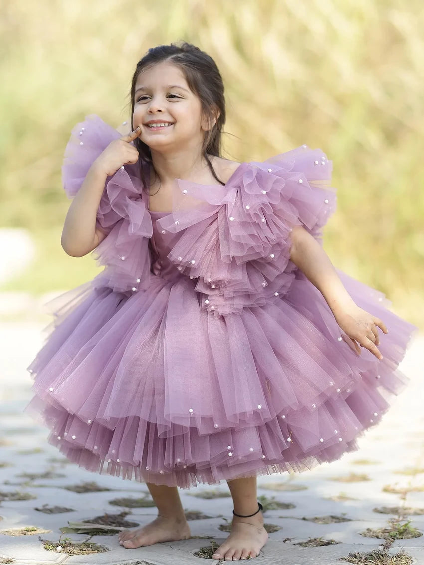 Front view of lavender pearl-embellished puffy tulle gown for flower girls.