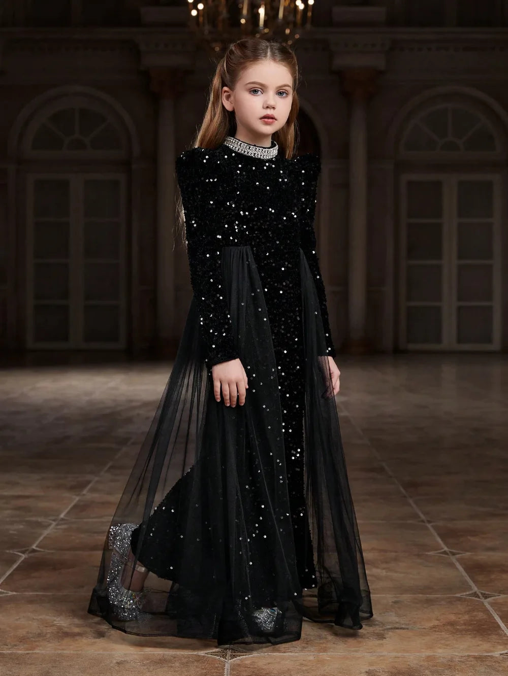 Side view of black velvet dress bodice featuring sparkling accents and soft, luxurious velvet fabric.