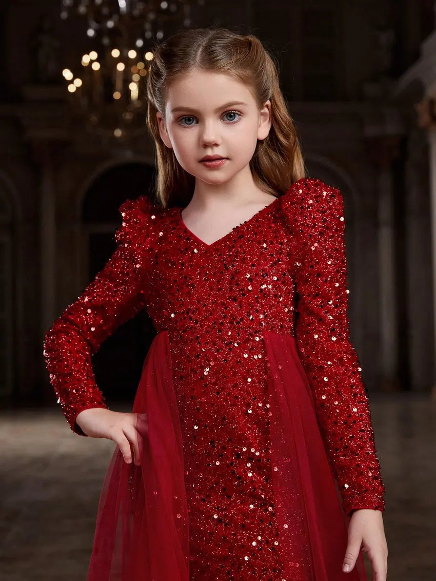 Close-up of red sequin bodycon dress with intricate sequin details and soft tulle texture.