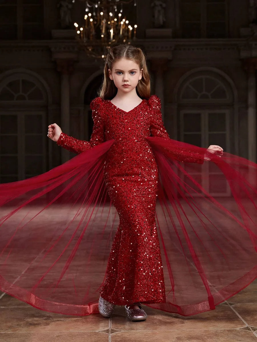 Full-length view of red sequin party dress for girls, showing bold red sequins and layered tulle.
