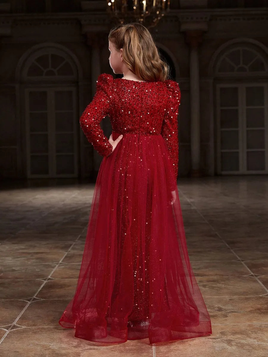 Back view of red sequin party dress highlighting the fitted silhouette and vibrant red shimmer.