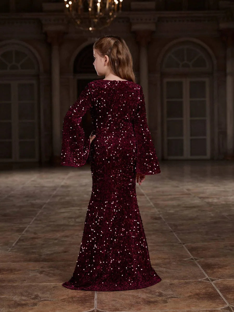 Back view of the red velvet mermaid gown for girls, highlighting the elegant design and sleek silhouette.