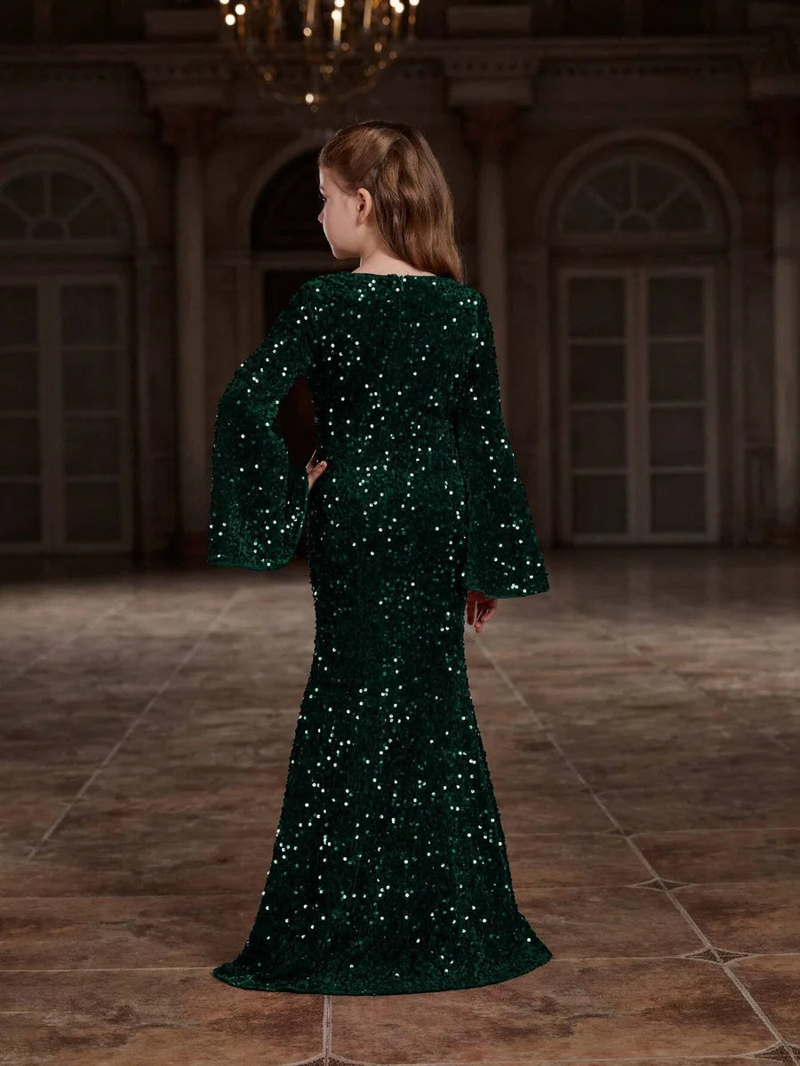 Back view of the green velvet mermaid gown for girls, emphasizing the graceful design and flattering silhouette.