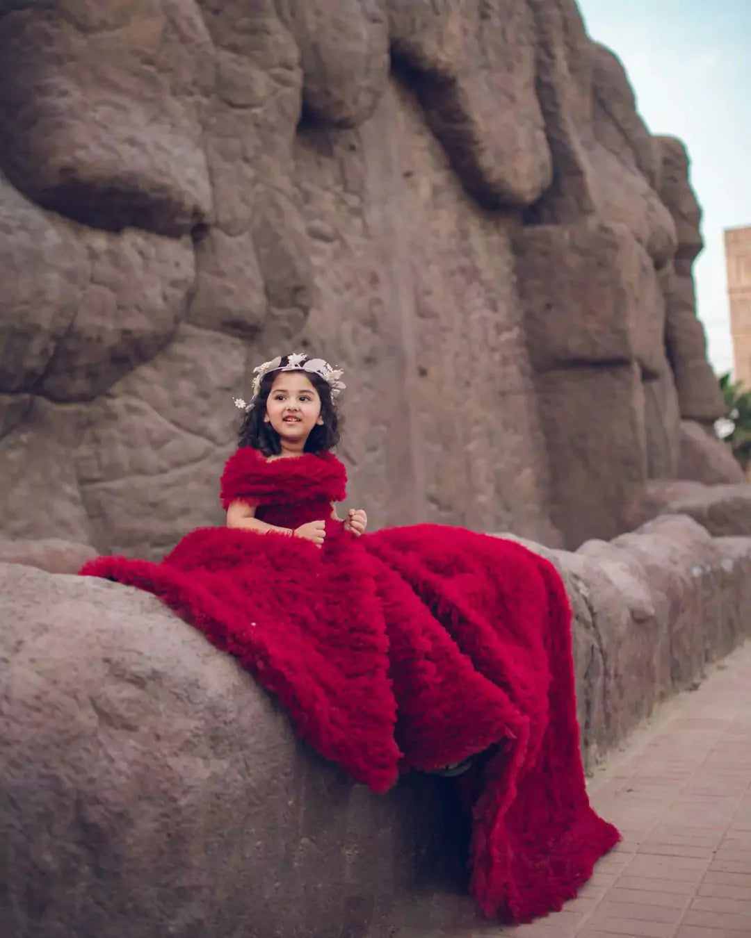 Close-up of bodice and train on girls' Red Princess Gown