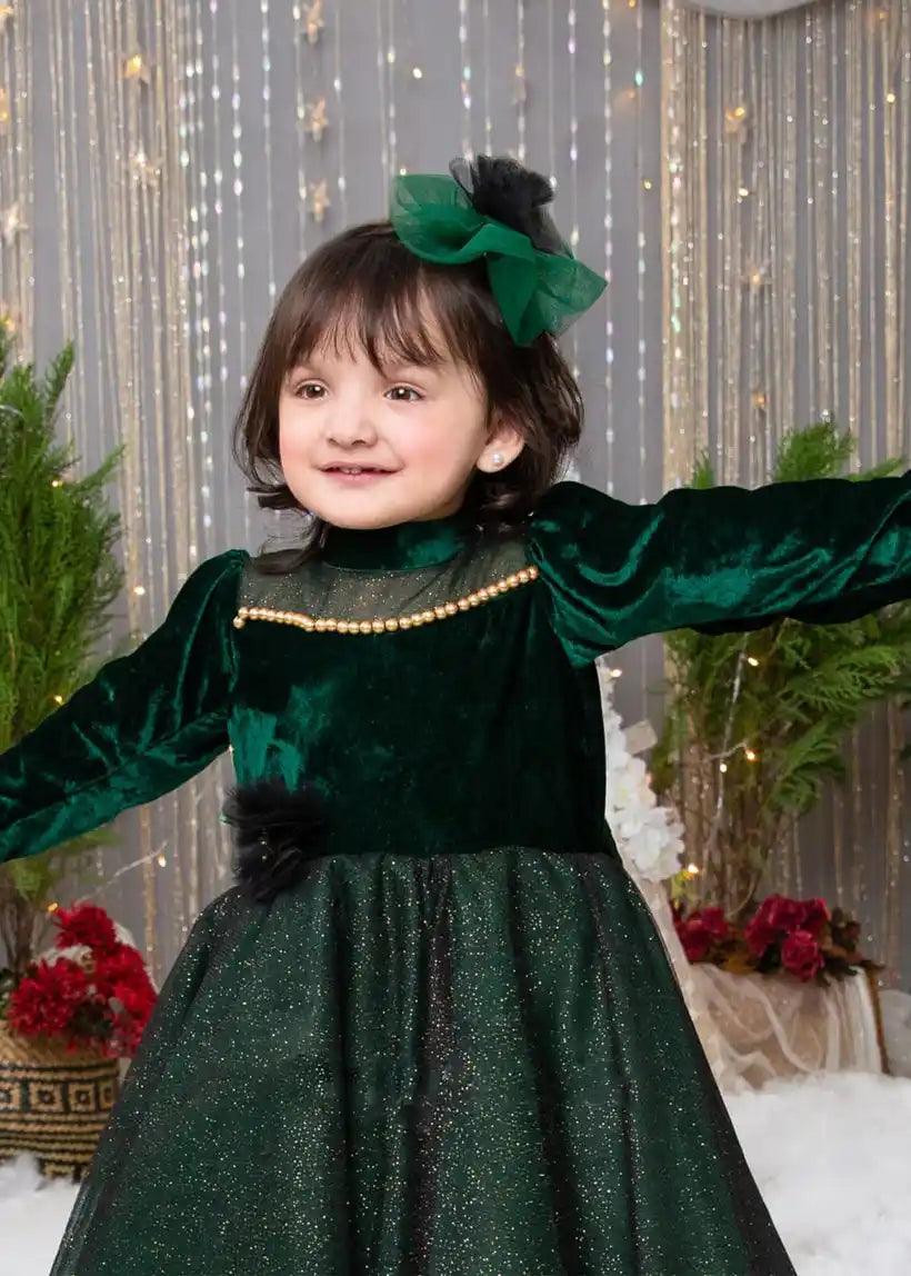 Close-up of the velvet bodice and shimmering tulle skirt on an elegant holiday dress for girls.