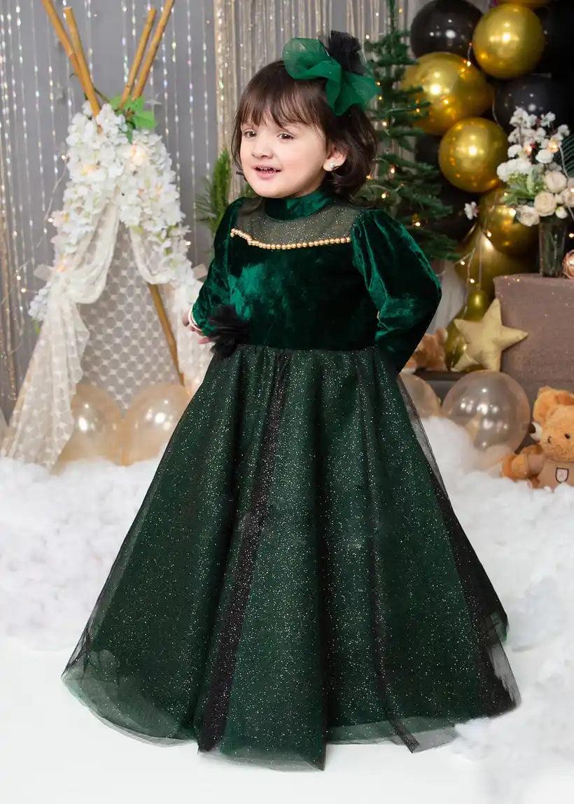 Side view of luxurious girls' holiday dress with velvet bodice and sparkling tulle skirt.