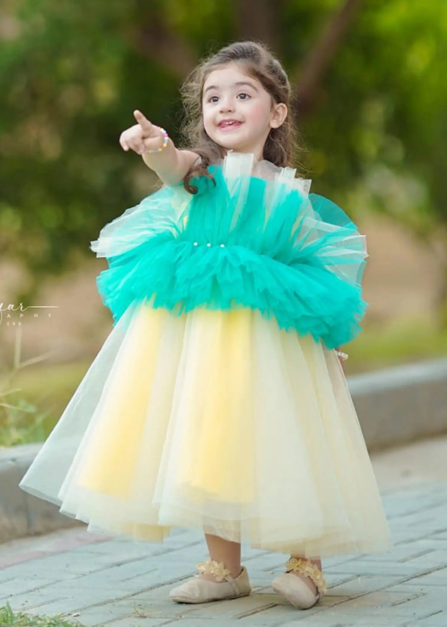 Close-up of tulle layers on Girls' Green & Yellow Tulle Party Dress