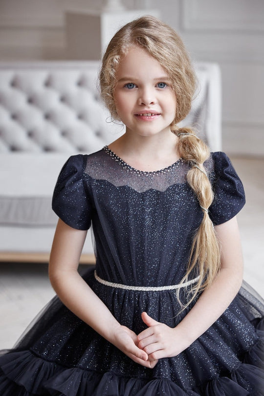 Close-up of Black Sparkling Ruffled Flower Girl Gown – shimmering black sparkle gown for girls