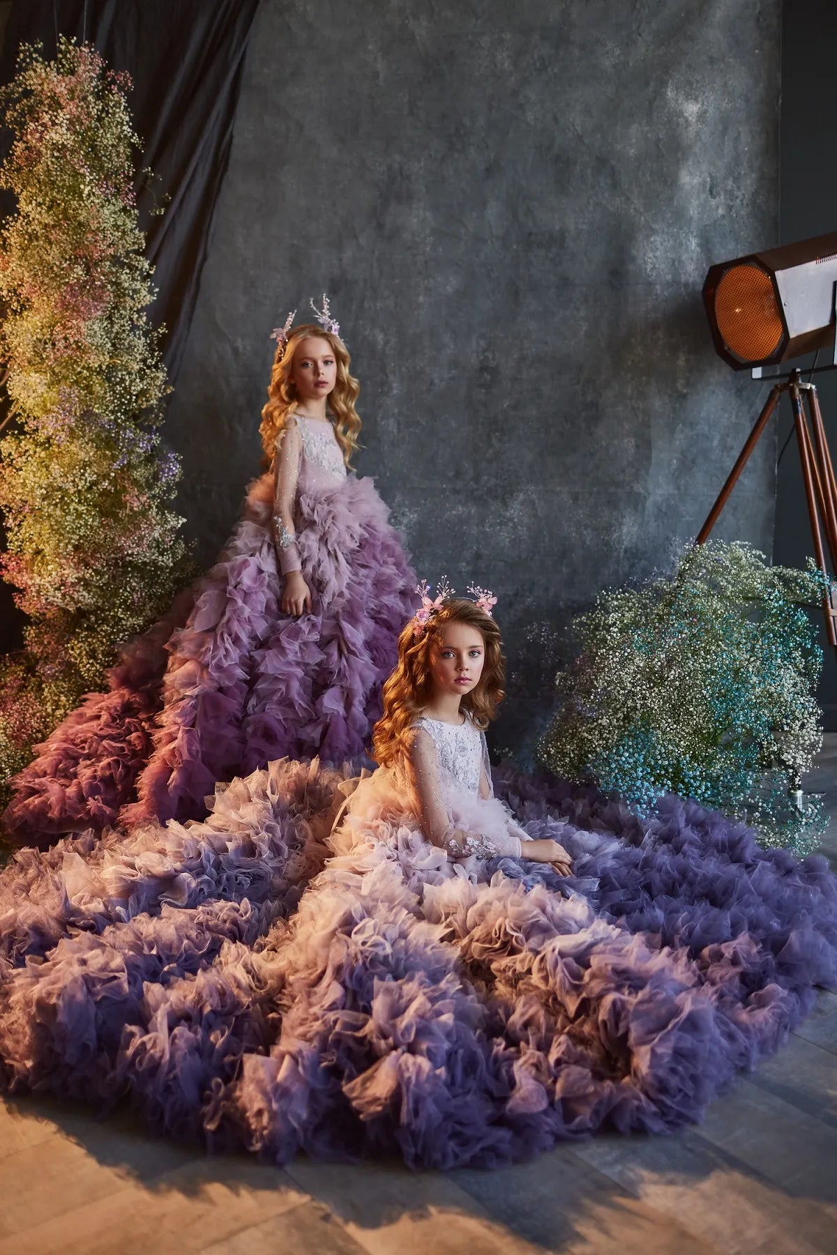 Side profile of the purple ruffled princess gown, highlighting the layers of soft tulle.