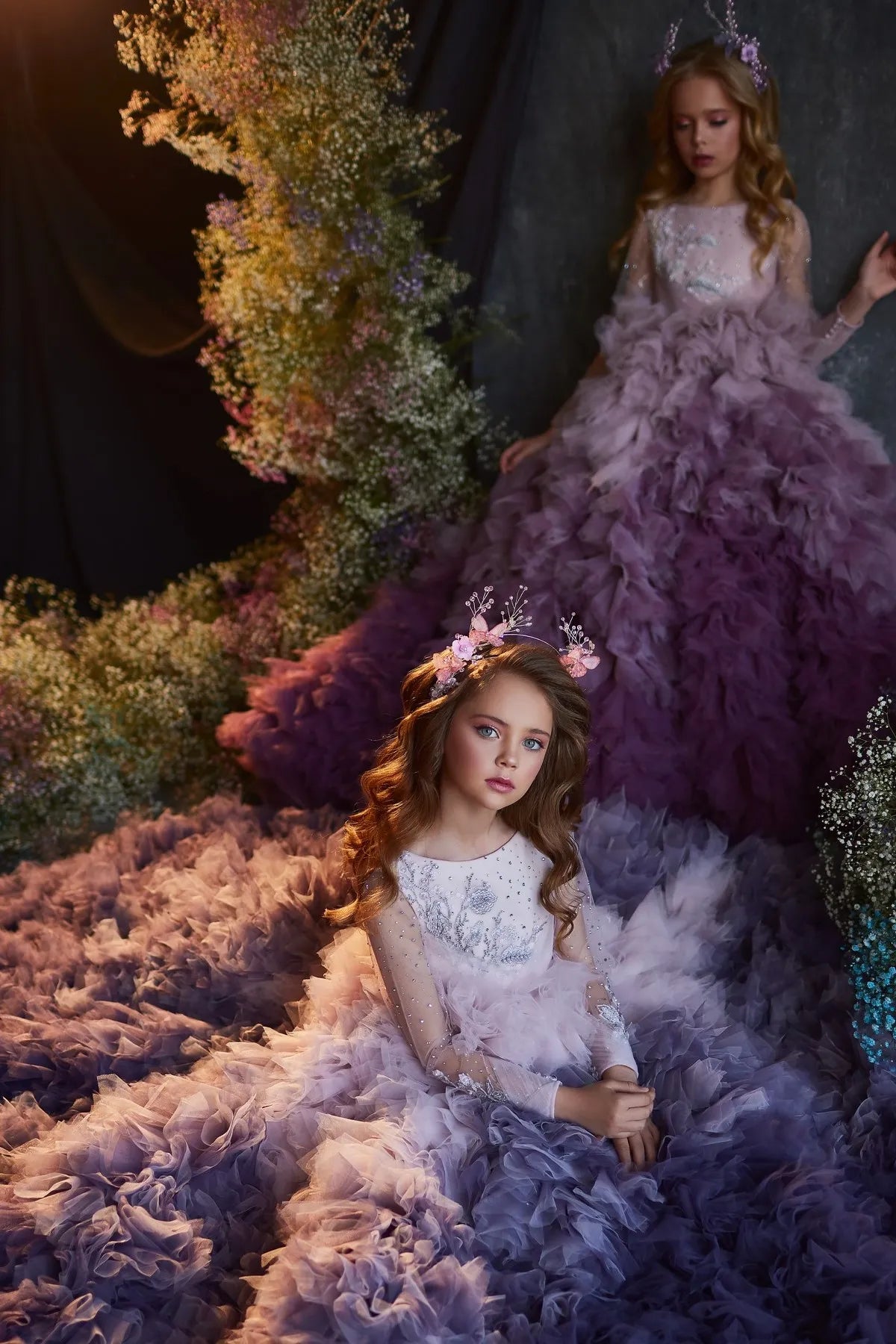 Front view showcasing the long flowing train of the luxury purple ruffled princess dress.