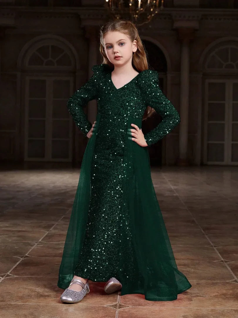 Side angle of green sequin dress with soft tulle and rich green shimmer for added elegance.