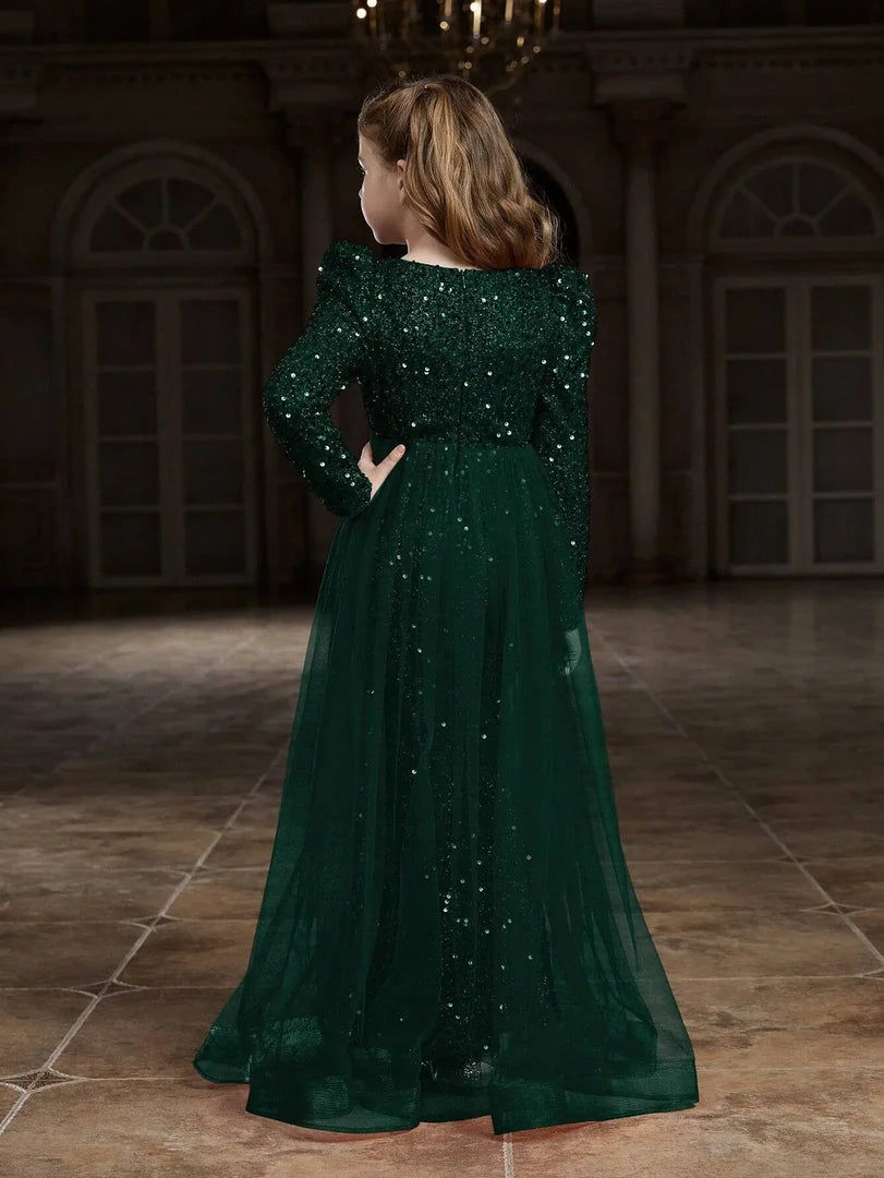 Back view of green sequin party dress highlighting the fitted style and sparkling sequins.