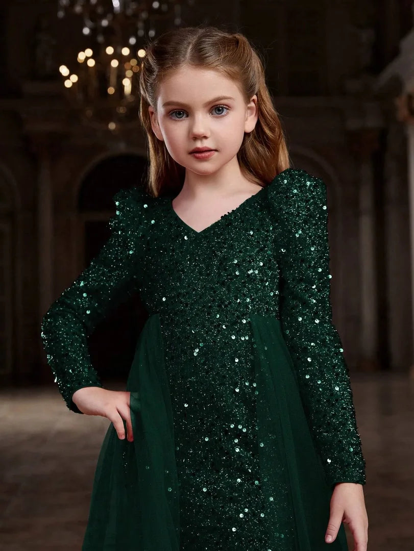 Close-up of green bodycon dress sequins showing detailed sparkle and soft tulle finish.