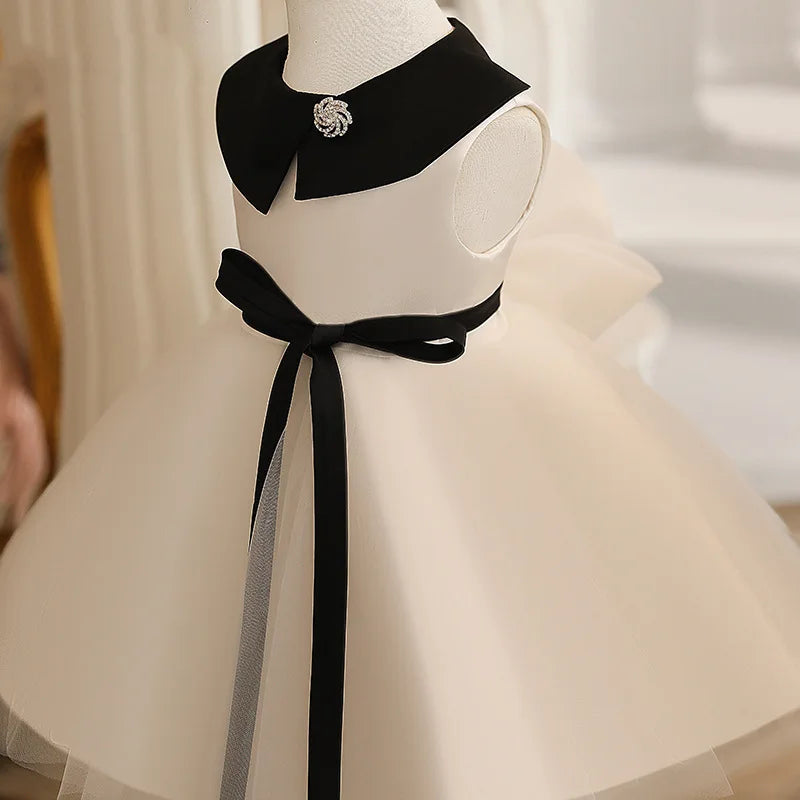 Side view of Ivory Tulle Dress with Peter Pan Collar – belted waist and tulle layers