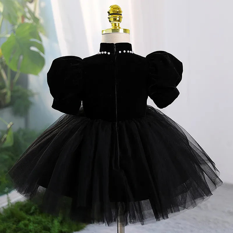 Back view of Black Velvet Dress – classic knee-length dress with delicate tulle skirt