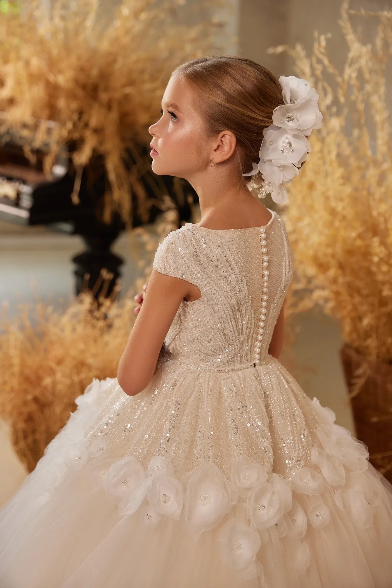 Side angle of the flowing tulle and elegant sequins on the Choosify flower girl dress.