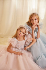 Front angle of Blush Pink & Powder Blue embroidered flower girl dress with ruffled sleeves and tulle skirt.