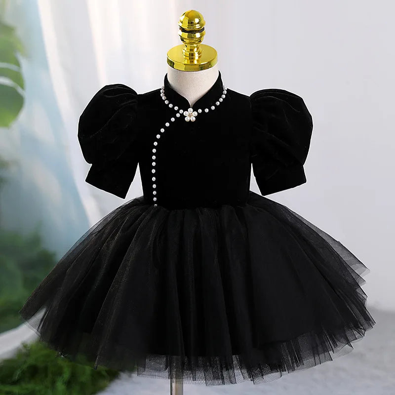 Front view of Black Velvet Dress with Pearl Embellishments – elegant black holiday dress for girls