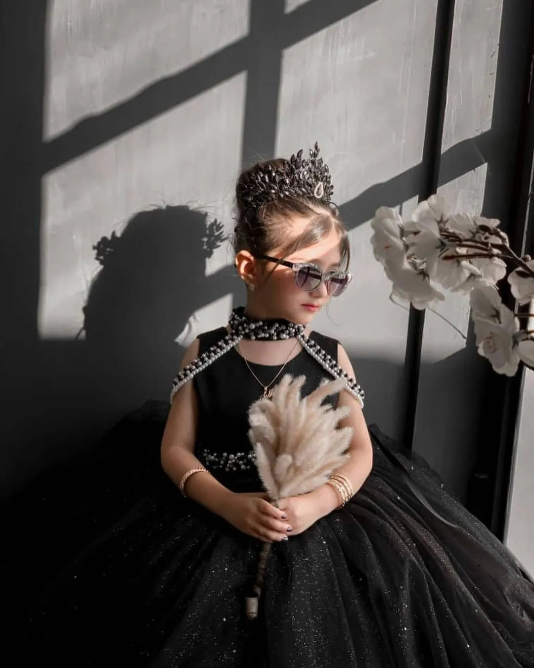 Side angle of Black Sparkling Princess Tulle Gown, showcasing the elegant tulle layers and sparkle details.