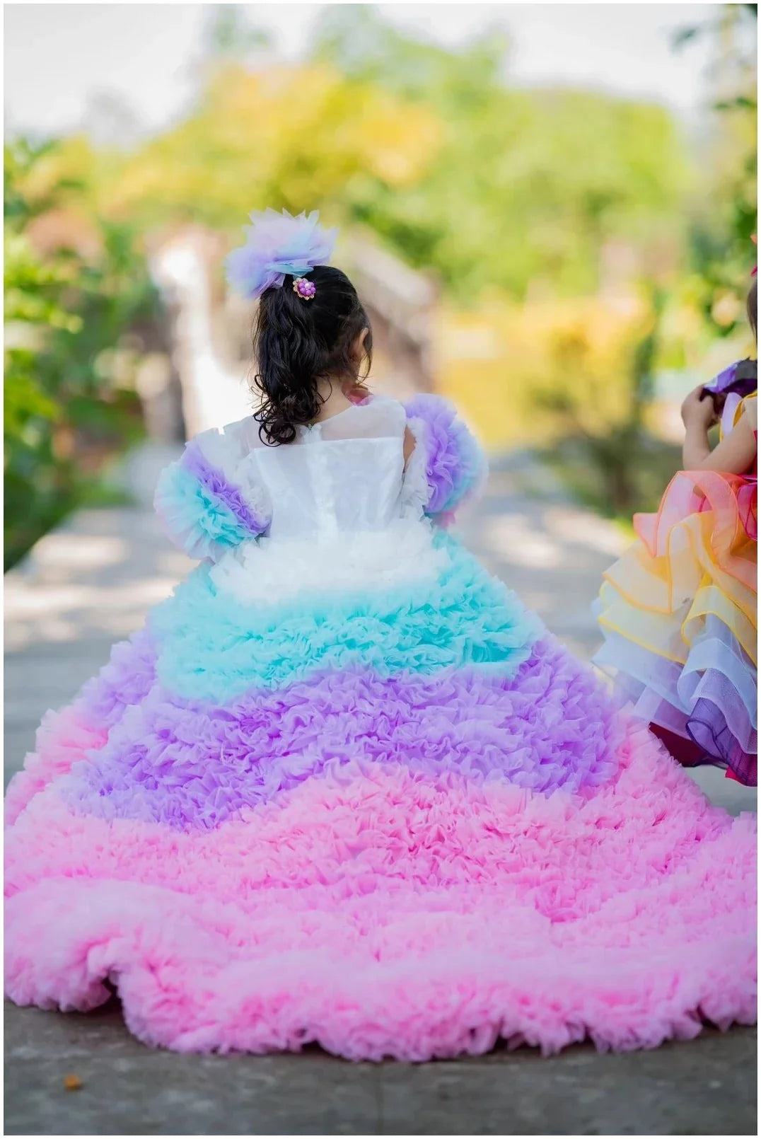 Back view of girls' Rainbow Tulle Ruffled Dress with layers