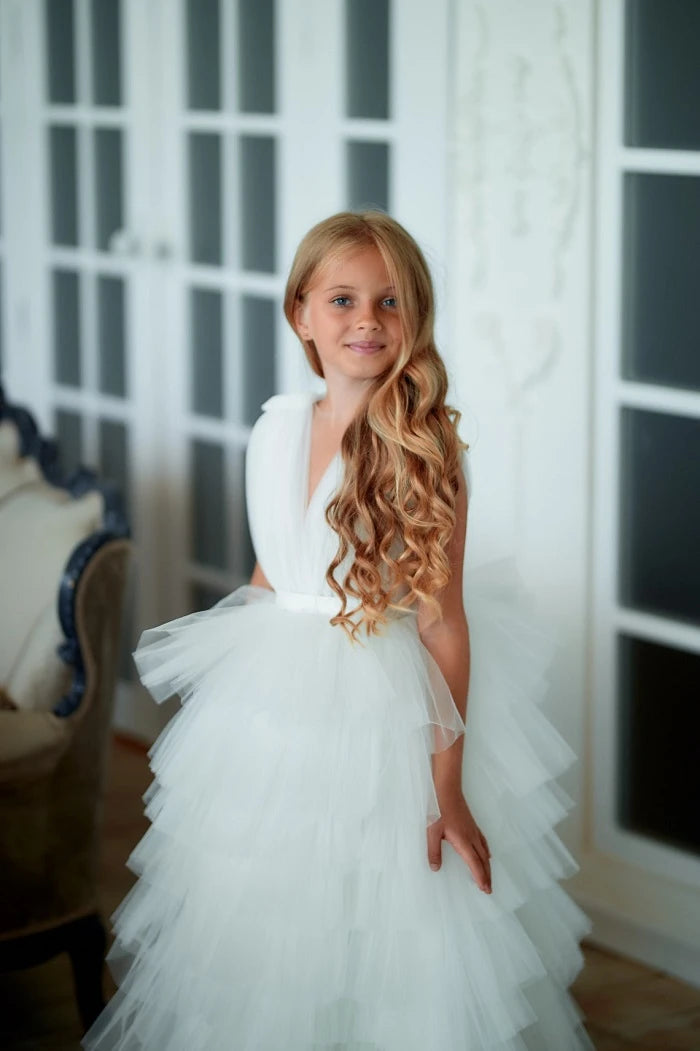 Side angle of White Tiered Tulle Pageant Dress, featuring tiered layers and soft tulle detail for an elegant silhouette