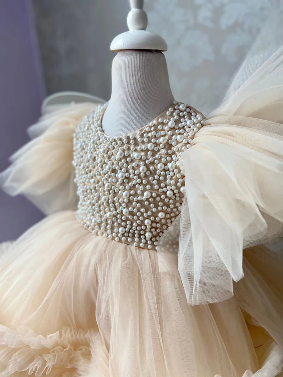 Close-up of Pearl Tulle Dress with Butterfly Wings – detailed butterfly wings and pearl embellishments