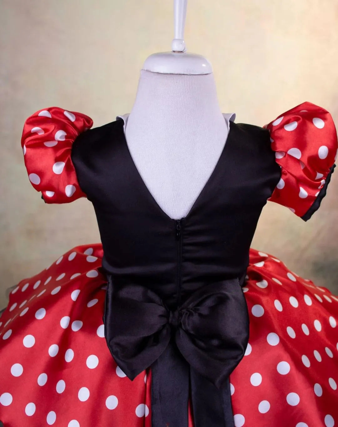 Back view of a Disney-themed dress for toddlers, showcasing a comfortable fit and Disney-inspired design.